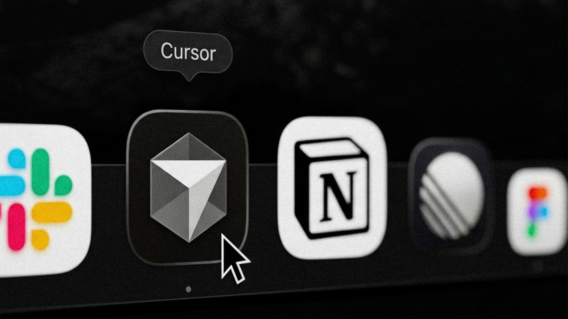 Close-up of a macOS dock showing the app icons for Cursor and Notion, with a mouse pointer hovering over the Cursor icon